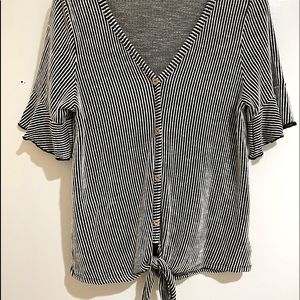 Cute black and white striped shirt with ruffles on the sleeves. Size Medium.